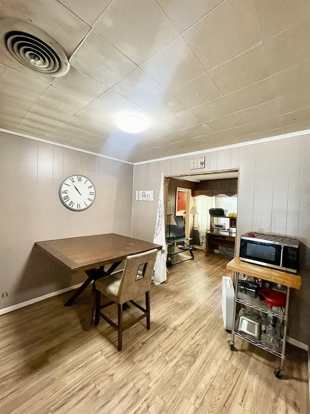 dining area with light hardwood / wood-style floors