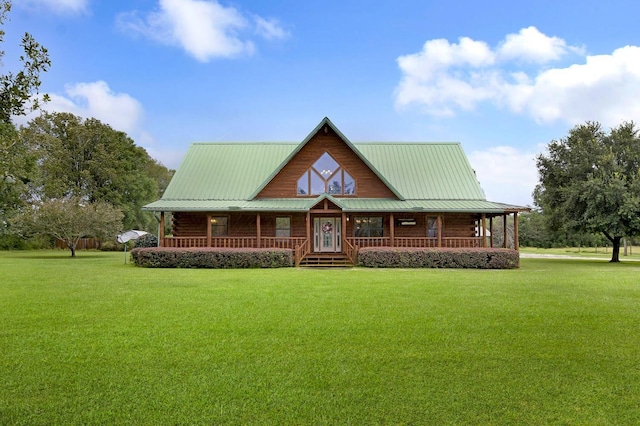 cabin with covered porch and a front yard