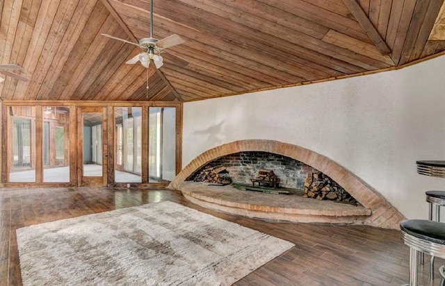 unfurnished room with ceiling fan, wood ceiling, dark hardwood / wood-style flooring, and lofted ceiling