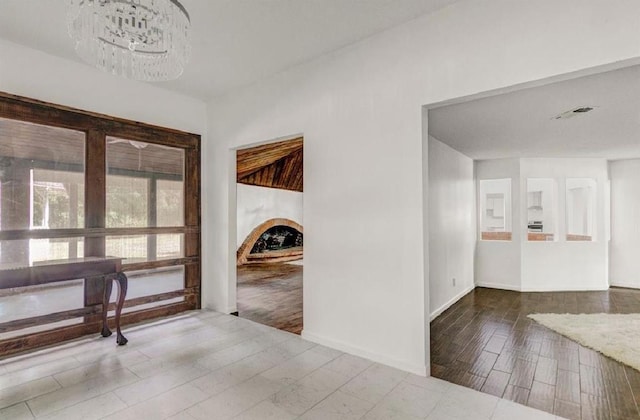 entryway featuring a notable chandelier and hardwood / wood-style floors