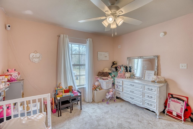 carpeted bedroom featuring ceiling fan