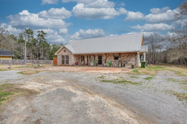 ranch-style home with a playground