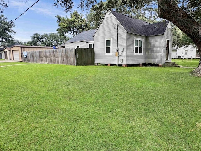 330 Avenue E Ave E, Port Neches, TX 77651 - view of side of home with roof with shingles