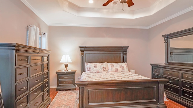 4363 Captain Kidd Way, Beaumont, TX 77713 - bedroom with a raised ceiling, wood finished floors, crown molding, and ceiling fan