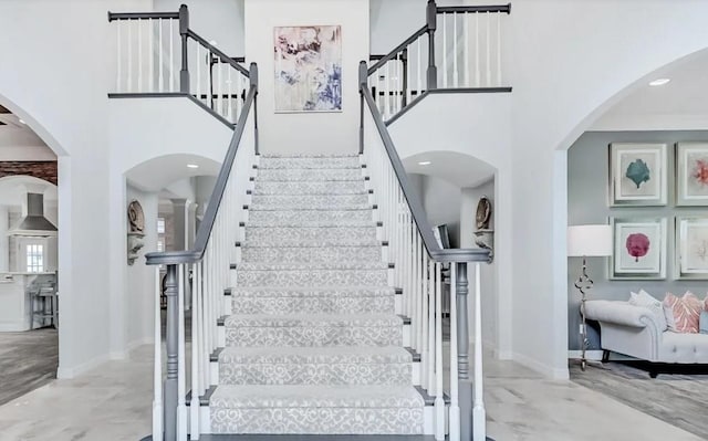 5065 Oakmont Dr, Beaumont, TX 77706 - stairway with a high ceiling and arched walkways