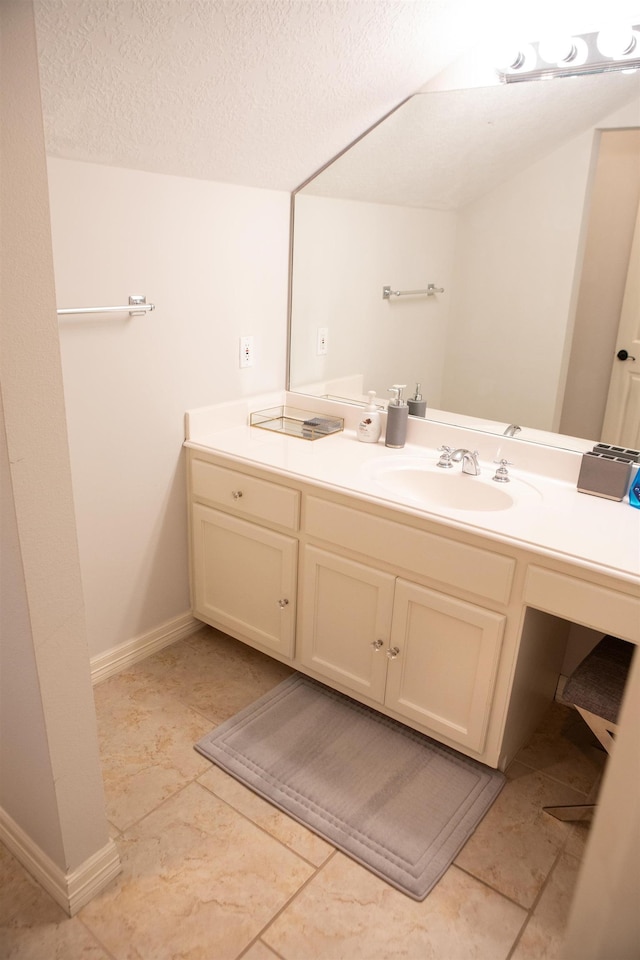 5065 Oakmont Dr, Beaumont, TX 77706 - bathroom featuring vanity and a textured ceiling