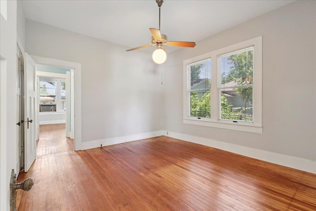 507 Orange Ave, Orange, TX 77630 - spare room with healthy amount of natural light, light wood-style floors, and a ceiling fan