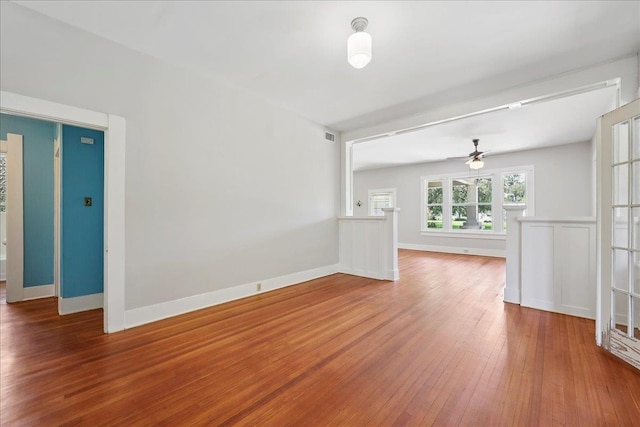 507 Orange Ave, Orange, TX 77630 - empty room with wood finished floors and a ceiling fan