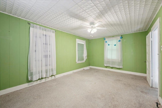 507 Orange Ave, Orange, TX 77630 - carpeted spare room featuring a ceiling fan and baseboards