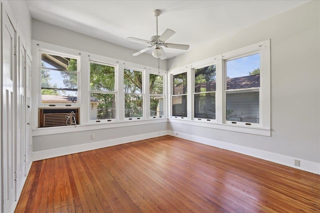 507 Orange Ave, Orange, TX 77630 - unfurnished sunroom with hardwood / wood-style flooring and cooling unit
