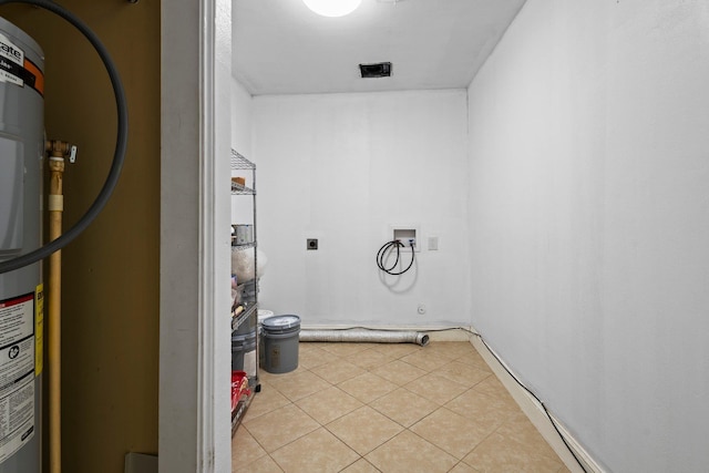 1503 18th St, Nederland, TX 77627 - laundry area with washer hookup, hookup for an electric dryer, and light tile patterned flooring