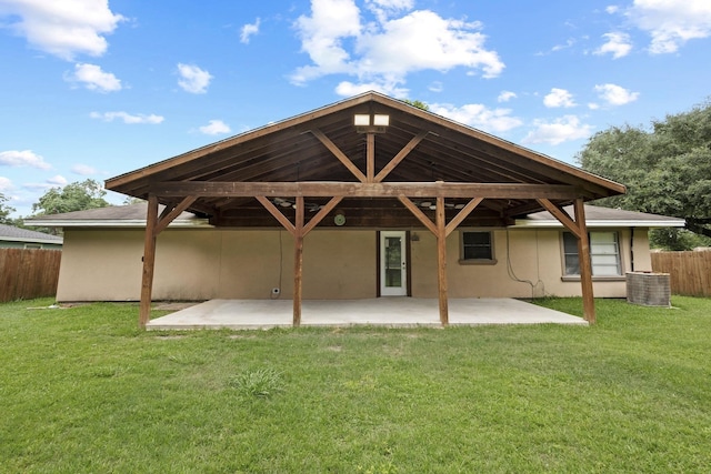 1503 18th St, Nederland, TX 77627 - back of property with a patio and stucco siding