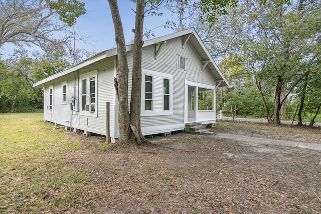 view of property exterior with a yard