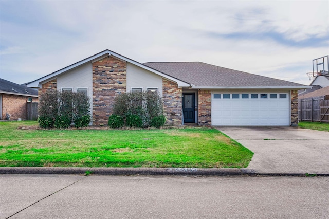 ranch-style house featuring a garage and a front yard