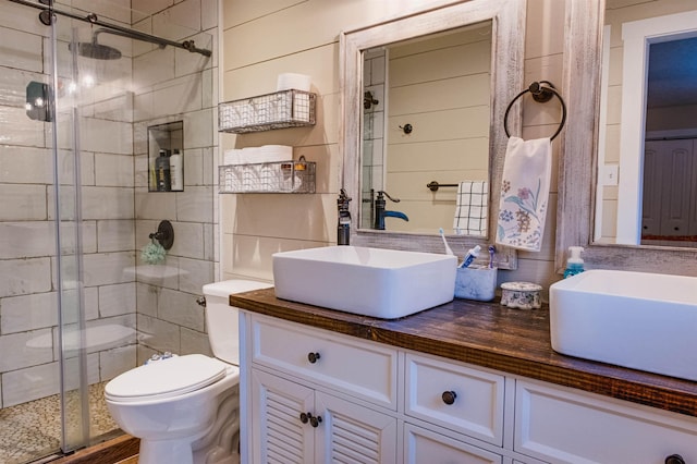 bathroom with vanity, an enclosed shower, and toilet