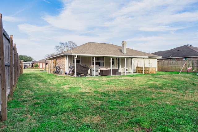 back of property featuring central AC unit, a yard, and an outdoor hangout area