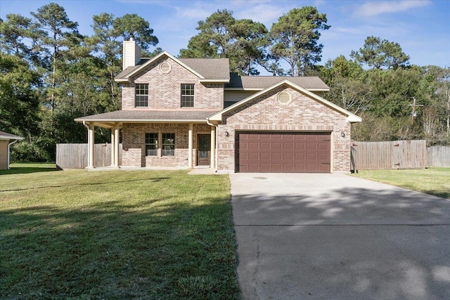 view of front of property featuring a front lawn and a garage