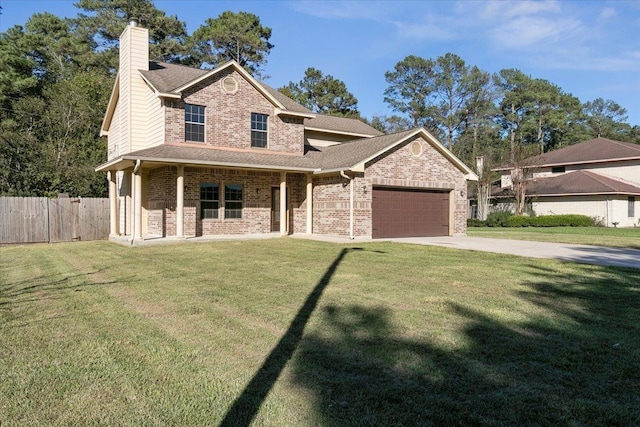 view of front of property with a front yard, a porch, and a garage