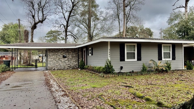 5440 Margo Ln, Beaumont, TX 77708 - single story home featuring fence, concrete driveway, and a carport