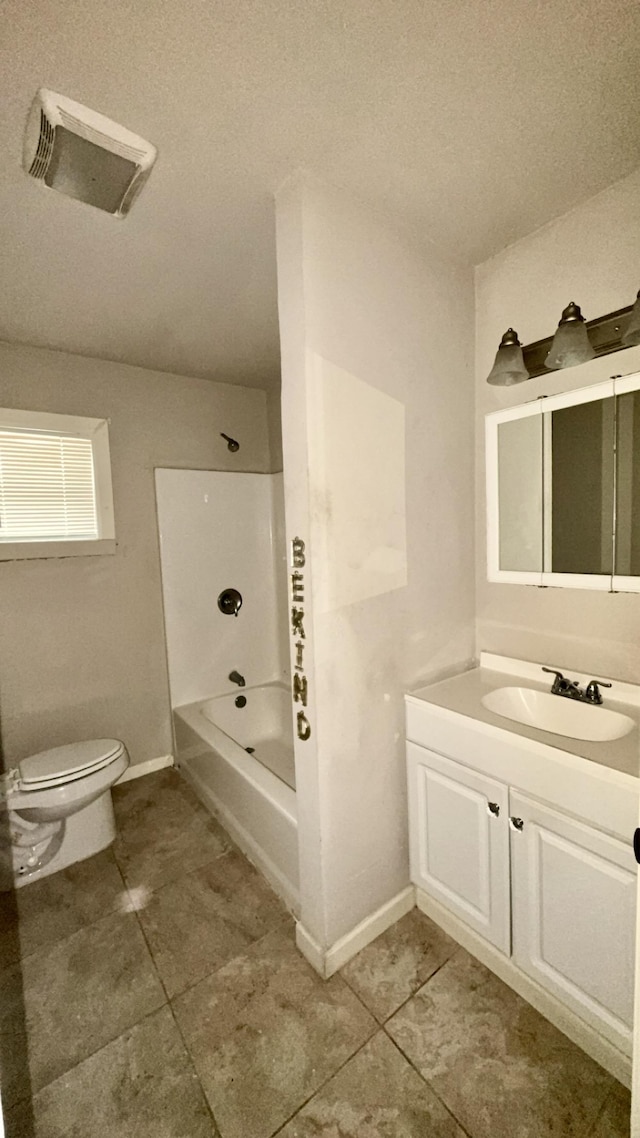 5440 Margo Ln, Beaumont, TX 77708 - bathroom with toilet, vanity, baseboards, and bathing tub / shower combination