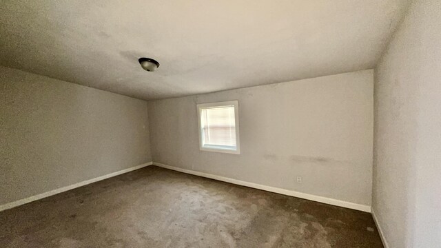 5440 Margo Ln, Beaumont, TX 77708 - empty room with baseboards and carpet floors