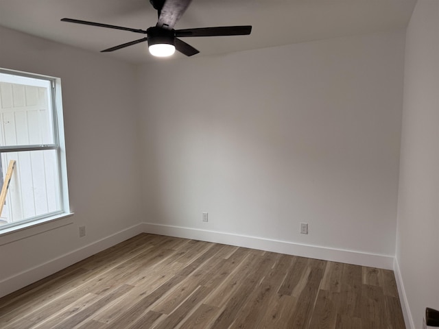 empty room with light wood-type flooring and ceiling fan