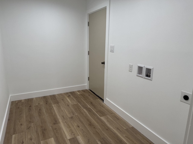 clothes washing area with hookup for a washing machine, electric dryer hookup, and wood-type flooring