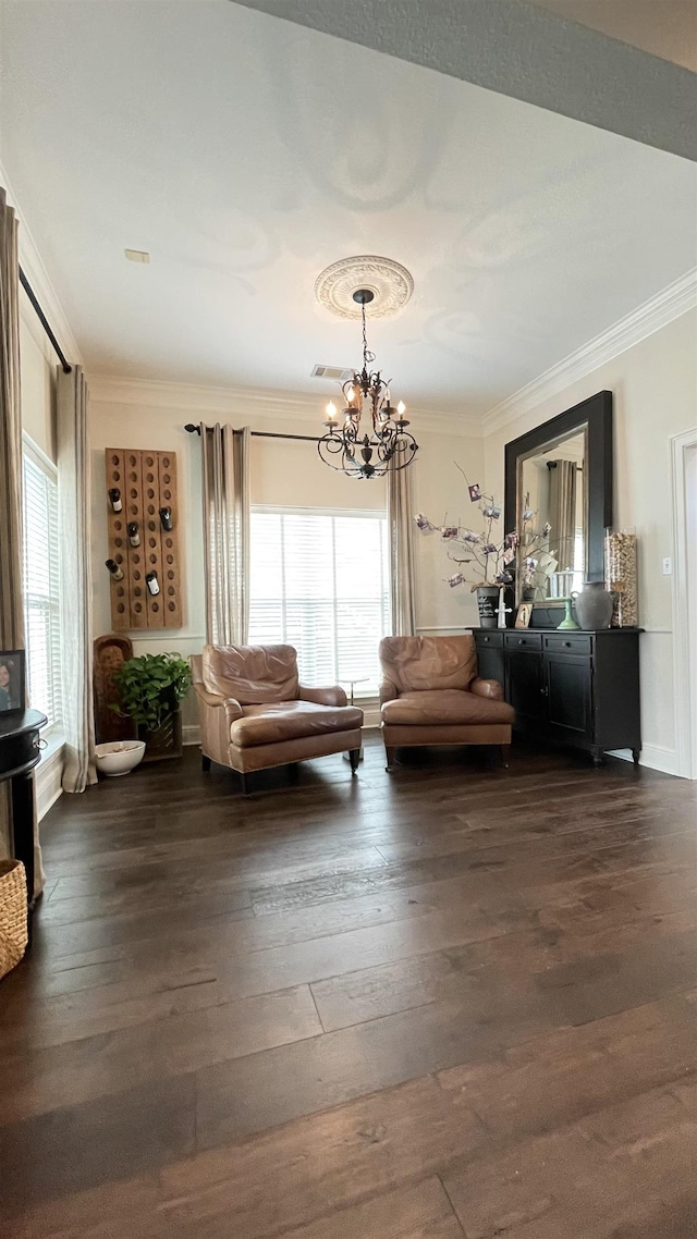 unfurnished room featuring dark hardwood / wood-style flooring, crown molding, a healthy amount of sunlight, and an inviting chandelier