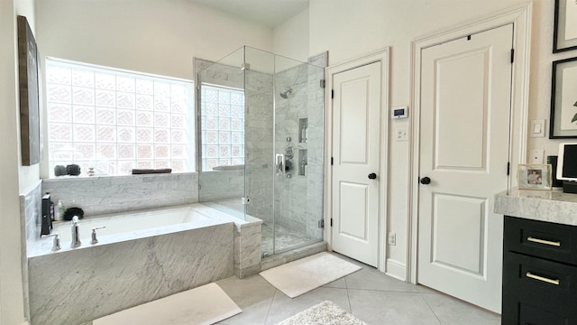 bathroom featuring vanity, tile patterned flooring, and independent shower and bath