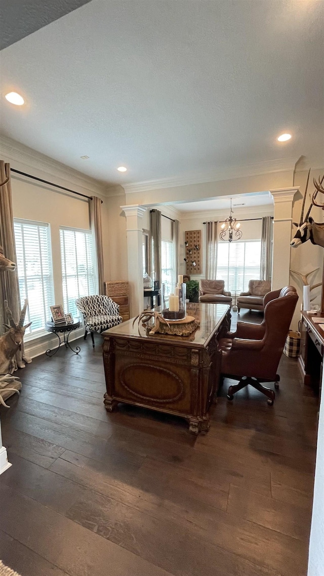 living room featuring dark wood-type flooring, ornamental molding, and a wealth of natural light