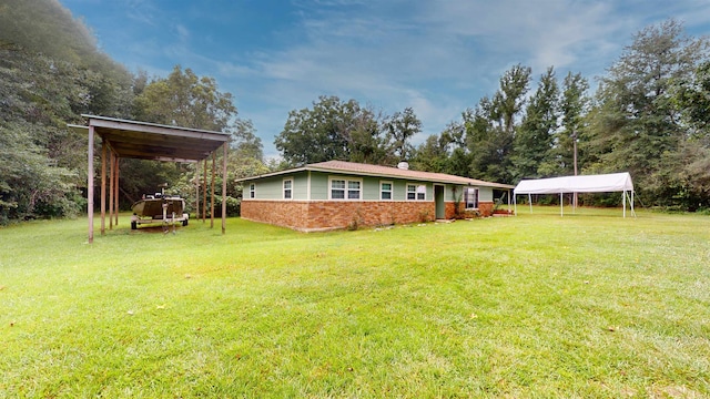 view of yard with a carport