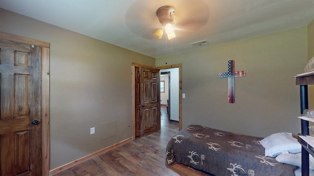 bedroom featuring ceiling fan and wood-type flooring