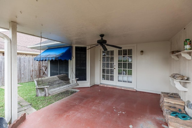 view of patio / terrace with fence, a ceiling fan, and french doors