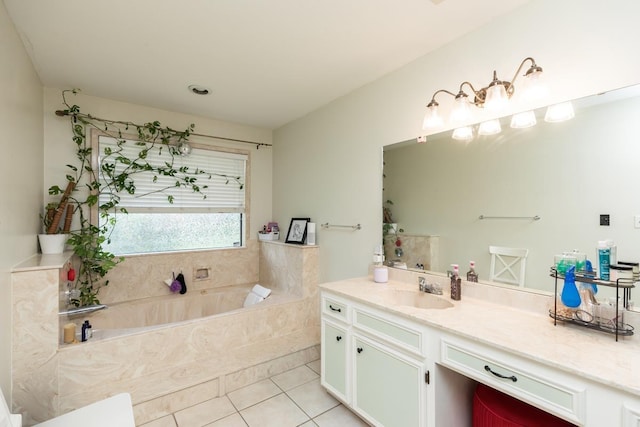 bathroom featuring tile patterned flooring, a bath, and vanity