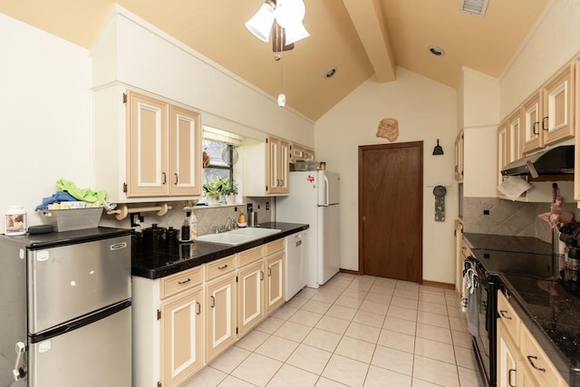 kitchen featuring a sink, under cabinet range hood, lofted ceiling with beams, tasteful backsplash, and white appliances