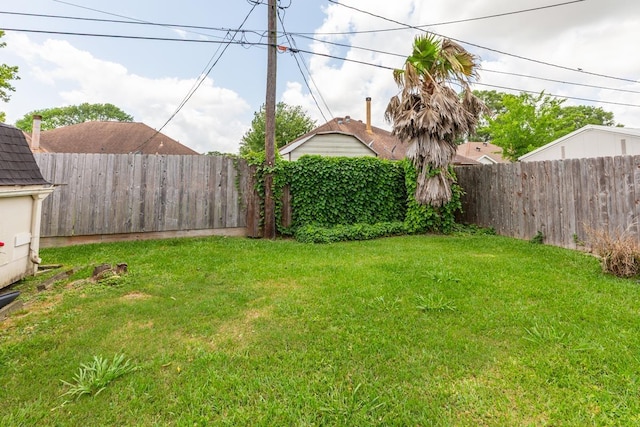 view of yard with a fenced backyard