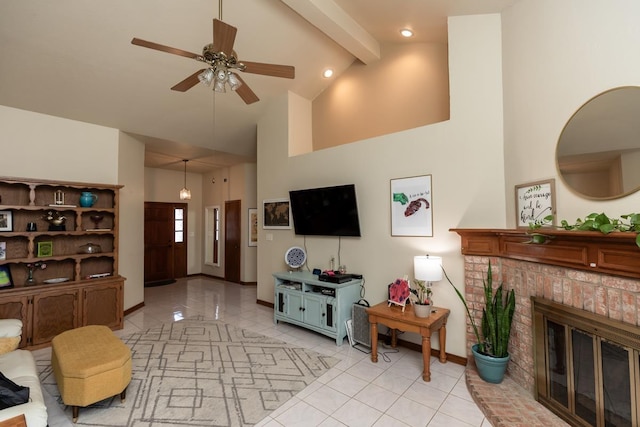living area with light tile patterned floors, baseboards, a fireplace, a ceiling fan, and high vaulted ceiling