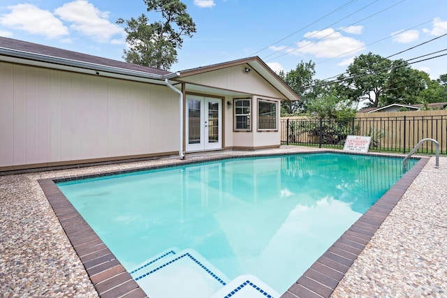 view of pool with french doors