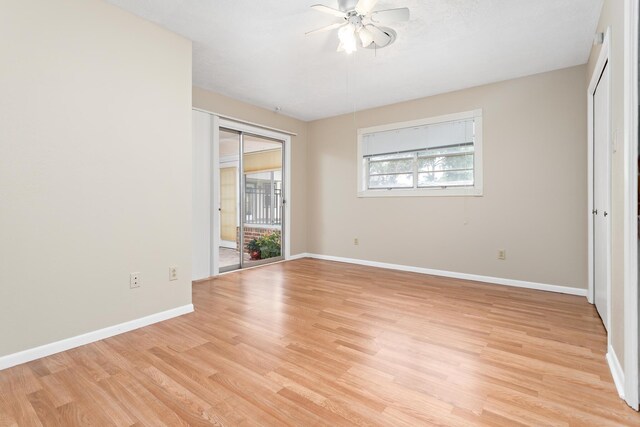 unfurnished bedroom featuring multiple windows, ceiling fan, and light hardwood / wood-style floors