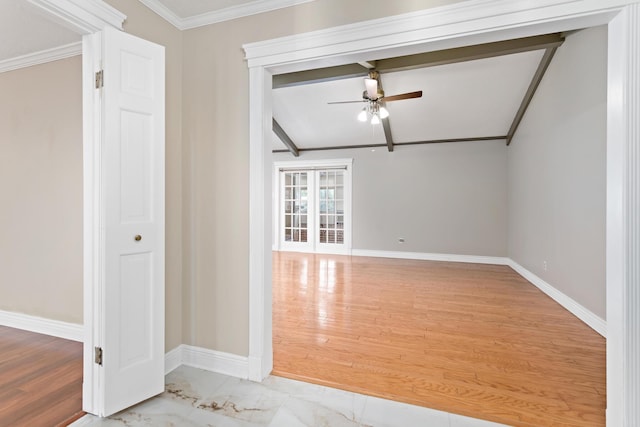 empty room with ceiling fan, lofted ceiling with beams, light wood-type flooring, and ornamental molding