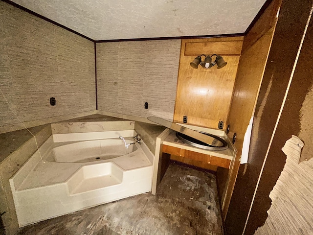 bathroom featuring a textured ceiling and a garden tub