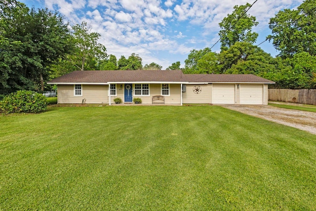 350 Holly St, Bridge City, TX 77611 - ranch-style house featuring dirt driveway, an attached garage, and covered porch