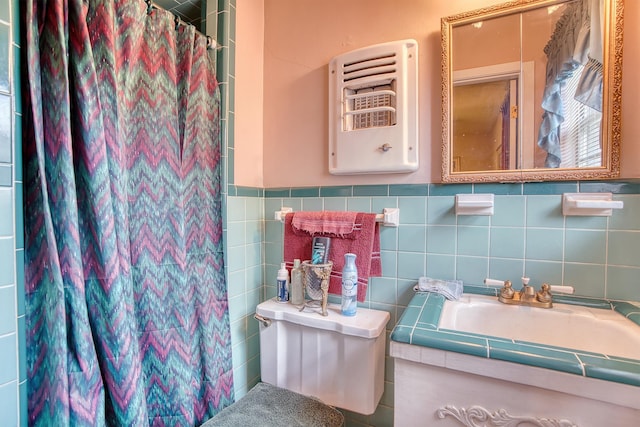 3435 Cecil Dr, Beaumont, TX 77706 - bathroom featuring a shower with shower curtain, vanity, tile walls, and toilet