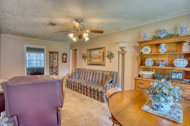 3435 Cecil Dr, Beaumont, TX 77706 - living area featuring a textured ceiling, carpet, a ceiling fan, and crown molding