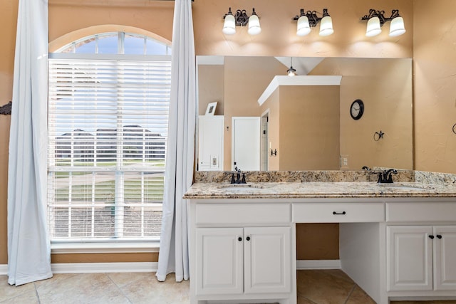 bathroom with tile patterned flooring and vanity