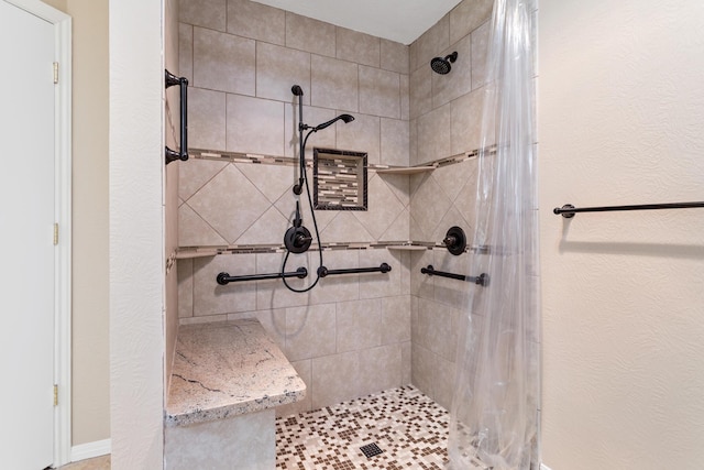 bathroom with a shower with shower curtain