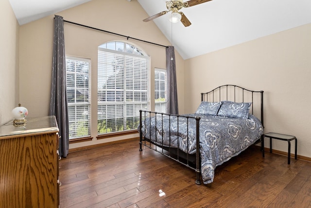 bedroom featuring dark hardwood / wood-style flooring, ceiling fan, and lofted ceiling