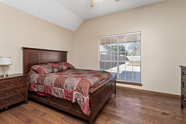 bedroom featuring ceiling fan, dark wood-type flooring, and vaulted ceiling