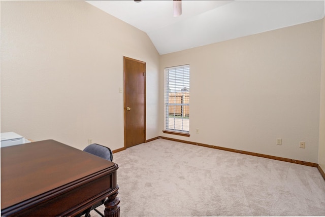 office featuring lofted ceiling and light carpet