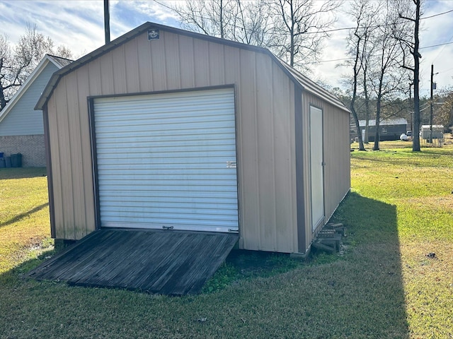 view of outbuilding with a lawn